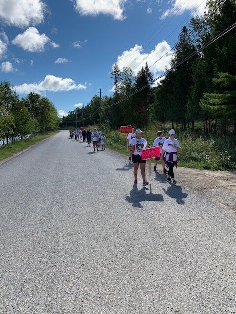 Participants strolling on the road