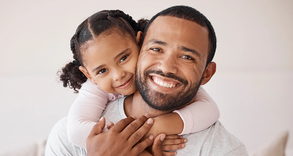 Daughter hugging father