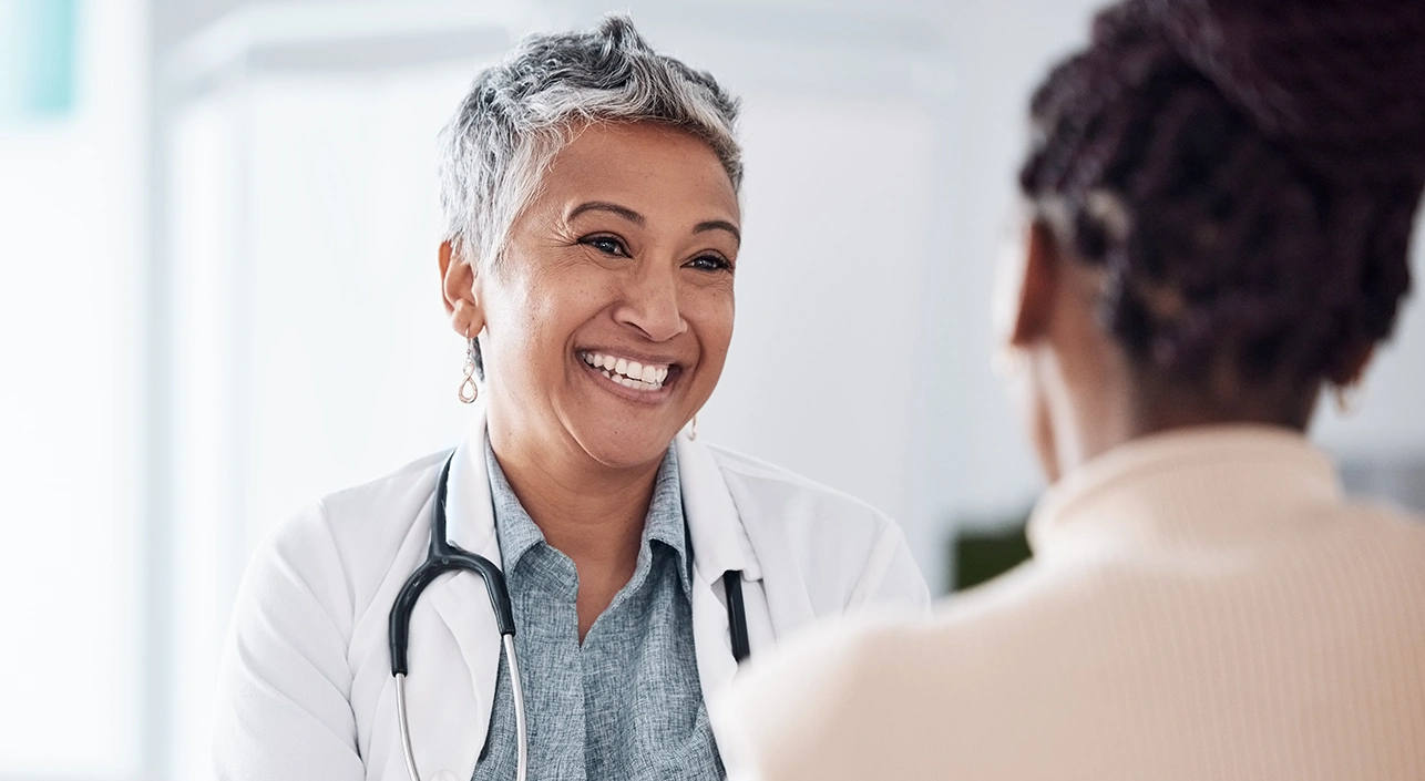 Woman speaking with doctor